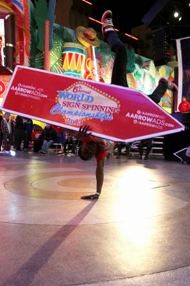 Theo Davis competes at the AArrow Sign Spinning company's championship Saturday, Feb. 23, 2013 at the Fremont Street Experience.
